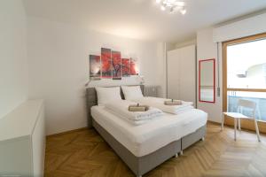 سرير أو أسرّة في غرفة في Apartment Duomo