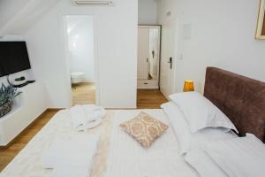Postel nebo postele na pokoji v ubytování Heritage Hotel Dea Hvar