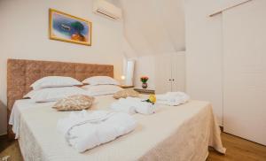 Postel nebo postele na pokoji v ubytování Heritage Hotel Dea Hvar