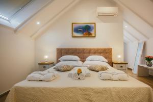 Postel nebo postele na pokoji v ubytování Heritage Hotel Dea Hvar