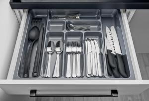 a drawer filled with utensils in a refrigerator at Native Apartments Rajska 3 in Kraków