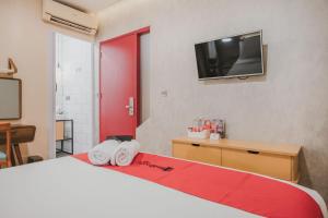 Ένα ή περισσότερα κρεβάτια σε δωμάτιο στο RedDoorz Plus @ Thamrin