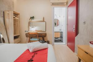 Ένα ή περισσότερα κρεβάτια σε δωμάτιο στο RedDoorz Plus @ Thamrin