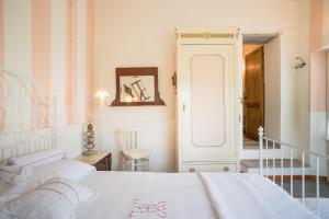 Postel nebo postele na pokoji v ubytování B&B Rosso Baccara