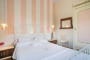 Postel nebo postele na pokoji v ubytování B&B Rosso Baccara