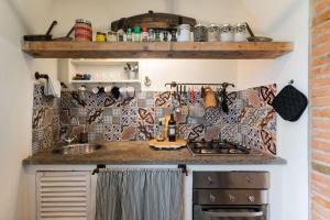 a kitchen with a sink and a counter at Casa Belvedere Firenze in Florence +29 photos