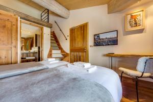 מיטה או מיטות בחדר ב-Chalet Hotel Du Fornet