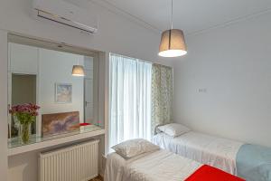 Posteľ alebo postele v izbe v ubytovaní Marveco Apartment