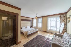 Postel nebo postele na pokoji v ubytování Lalinn Hotel