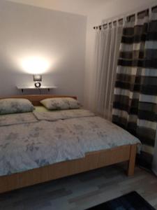 Postel nebo postele na pokoji v ubytování Apartments ZP44