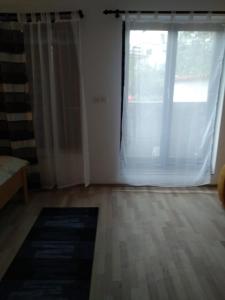 Postel nebo postele na pokoji v ubytování Apartments ZP44