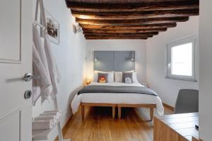 A bed or beds in a room at Casa Modelli