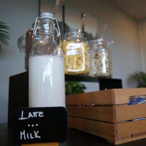 a bottle of milk sitting on top of a box at Fabulous village in Casal Palocco
