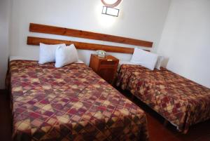 Postel nebo postele na pokoji v ubytování Hotel Alux Cancun