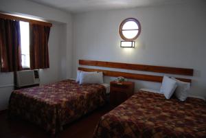 Postel nebo postele na pokoji v ubytování Hotel Alux Cancun