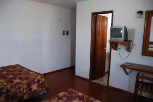 TV a/nebo společenská místnost v ubytování Hotel Alux Cancun
