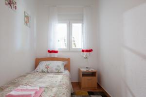 Postel nebo postele na pokoji v ubytování Villa Nedika