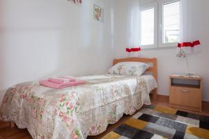 Postel nebo postele na pokoji v ubytování Villa Nedika