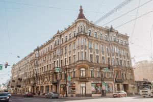 a large building on the corner of a street at Hotel Vera in Saint Petersburg