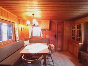 a dining room with a table and a window at Waldheimat in Fresach