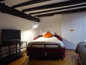 Postel nebo postele na pokoji v ubytování Giudei House Bologna