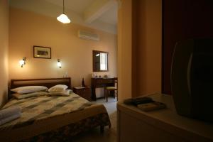 Postel nebo postele na pokoji v ubytování Mirabello Hotel