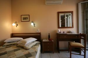 Postel nebo postele na pokoji v ubytování Mirabello Hotel