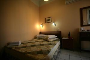 Postel nebo postele na pokoji v ubytování Mirabello Hotel