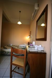 Postel nebo postele na pokoji v ubytování Mirabello Hotel
