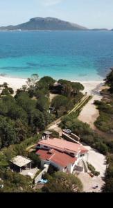 an aerial view of a house on the beach at VILLA ARANZOS in Golfo Aranci