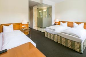 Posteľ alebo postele v izbe v ubytovaní Hotel Sailer