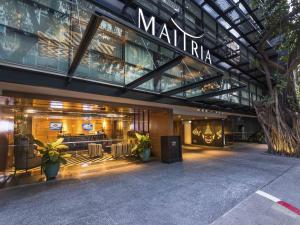 a store front of a mall with a sign on it at Maitria Hotel Sukhumvit 18 Bangkok – A Chatrium Collection in Bangkok