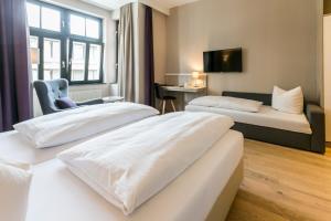 Posteľ alebo postele v izbe v ubytovaní Hotel Sailer