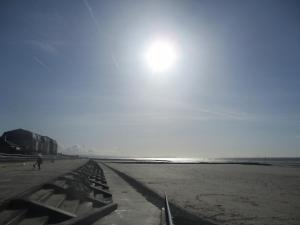a view of a beach with the sun in the sky at Beaches Chalets in Prestatyn