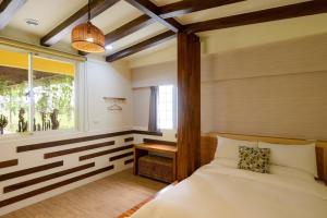 Postel nebo postele na pokoji v ubytování Ming Shui Lu Homestay