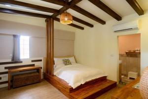 Postel nebo postele na pokoji v ubytování Ming Shui Lu Homestay