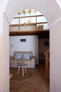 a living room with a couch and a table at Casas de Mértola 33 in Mértola