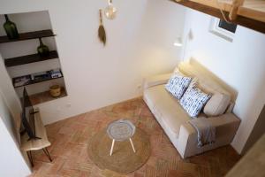 a living room with a couch and a table at Casas de Mértola 33 in Mértola