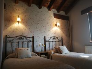 Säng eller sängar i ett rum på El MIRADOR DE TONO , Casa entera