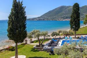 a resort with a pool and a beach at Agni Suites in Nikiana