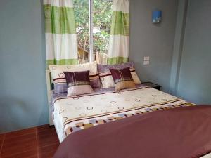Postel nebo postele na pokoji v ubytování Chandra Hostel Koh Tao