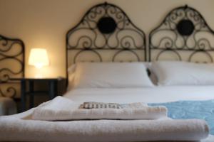 Säng eller sängar i ett rum på B&B Casa Del Priore