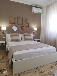 Postel nebo postele na pokoji v ubytování Ostuni Crispi House
