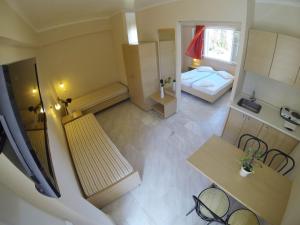 Posteľ alebo postele v izbe v ubytovaní Happyland Hotel Apartments