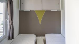 A bed or beds in a room at IdeaLazise Camping and Village