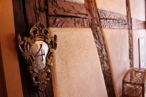 a mirror hanging on a wall in a room at Gasthaus Sonne in Schliengen