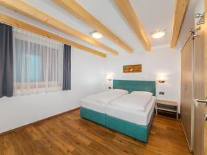 Postel nebo postele na pokoji v ubytování Residence Brunello
