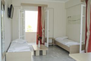 Posteľ alebo postele v izbe v ubytovaní Happyland Hotel Apartments