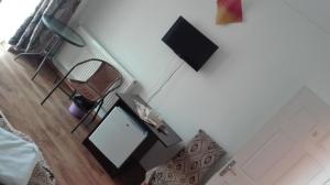 TV a/nebo společenská místnost v ubytování Vila Ariana
