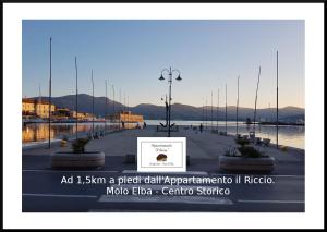 a picture of a street with a sign in the middle at Appartamento il Riccio in Portoferraio